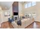 Bright living room featuring a fireplace, soaring ceilings, large windows, and comfortable seating at 15319 Venezia Ln, Huntersville, NC 28078