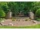 Neighborhood sign surrounded by stone wall and lush greenery at 1808 Therrell Farms Rd, Waxhaw, NC 28173