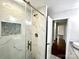 Stylish bathroom with a glass shower featuring marble tiling, a niche, and modern fixtures at 1936 Russell Ave, Charlotte, NC 28216