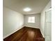 Cozy bedroom with hardwood floors, a neutral color palette, and ample natural light at 1936 Russell Ave, Charlotte, NC 28216