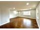 Bright and open living room boasts beautiful hardwood floors and fresh, neutral paint at 1936 Russell Ave, Charlotte, NC 28216