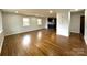 Spacious living room featuring gleaming hardwood floors and abundant natural light at 1936 Russell Ave, Charlotte, NC 28216