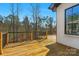 Wide wooden deck with black metal railing for entertaining and views of wooded backyard at 2013 Gladelynn Ct # 354, Belmont, NC 28012