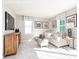 Cozy living room featuring a comfortable sofa, entertainment center, and window with natural light at 2132 Primm Farms Dr, Charlotte, NC 28216