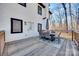 Back deck featuring an outdoor dining set, and a door leading to the interior of the home at 2143 Country Club Rd, Lincolnton, NC 28092