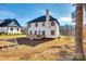 Exterior of the home featuring a wooden deck, a large grassy yard and mature trees at 2143 Country Club Rd, Lincolnton, NC 28092