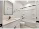 Bright bathroom featuring a modern bathtub, a sink with white stone countertops, and a toilet at 2143 Country Club Rd, Lincolnton, NC 28092