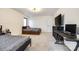 Bedroom with carpet floors, two beds, a desk, and a large window with views of the outside at 2143 Country Club Rd, Lincolnton, NC 28092