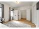 Bright bedroom featuring modern wardrobe, stylish rug, and a large window with views of the outside at 2143 Country Club Rd, Lincolnton, NC 28092