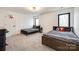Bedroom with carpet floors, two beds, and a large window with views of the outside at 2143 Country Club Rd, Lincolnton, NC 28092