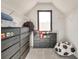 Walk in closet with custom drawers and shelving with a large window and natural light at 2143 Country Club Rd, Lincolnton, NC 28092