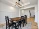 Dining room featuring wood table, black chairs, bench seating, and stylish light fixture at 2143 Country Club Rd, Lincolnton, NC 28092