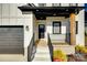 Inviting front entrance featuring a black door, sidelight, and a covered porch at 2143 Country Club Rd, Lincolnton, NC 28092