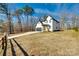 Exterior of the home with a long driveway and mature trees at 2143 Country Club Rd, Lincolnton, NC 28092