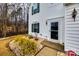 Charming entrance with a storm door, landscaped garden bed, and white siding at 226 Belfield Ln, Fort Mill, SC 29715