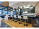 A modern kitchen bar featuring sleek countertops, pendant lighting, and contemporary bar stools at 310 Arlington Ave # 318, Charlotte, NC 28203