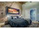 Main bedroom featuring hardwood floors, a sliding bathroom door and neutral color palette at 310 Arlington Ave # 318, Charlotte, NC 28203