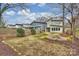 Landscaped backyard with a fire pit and a privacy fence at 3126 Creighton Dr, Charlotte, NC 28205