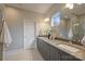 Bathroom featuring double sinks, modern cabinets and a large mirror at 3126 Creighton Dr, Charlotte, NC 28205