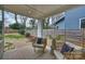 Inviting covered patio with stylish outdoor seating overlooking the landscaped backyard at 3126 Creighton Dr, Charlotte, NC 28205