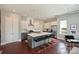 Modern kitchen with a large island, stainless steel appliances, white cabinets, and bar stool seating at 3126 Creighton Dr, Charlotte, NC 28205