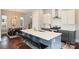 Bright kitchen with a large island, stainless steel appliances, and modern decor with adjacent dining area at 3126 Creighton Dr, Charlotte, NC 28205