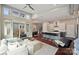 Open-concept living room with modern kitchen, staircase, and large windows providing plenty of natural light at 3126 Creighton Dr, Charlotte, NC 28205