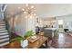 Open-concept layout showcasing the dining area, kitchen with island seating, and staircase at 3126 Creighton Dr, Charlotte, NC 28205