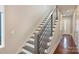 Modern staircase with gray and white risers and gray railing at 3126 Creighton Dr, Charlotte, NC 28205