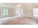 Bedroom with two windows, neutral carpet and walls at 3213 Mcharney Dr # 32, Harrisburg, NC 28075
