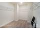 Walk-in closet featuring metal shelving, neutral carpet, and ample space for storage, making organization simple at 3213 Mcharney Dr # 32, Harrisburg, NC 28075