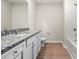 Bathroom featuring granite countertops and a tub/shower combo at 3263 Maple Ridge Dr, Gastonia, NC 28052