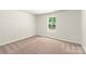 Empty bedroom with neutral carpet and one window at 3263 Maple Ridge Dr, Gastonia, NC 28052