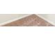 Close up of the tan carpeting and baseboards at 3263 Maple Ridge Dr, Gastonia, NC 28052