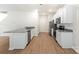 Kitchen with granite countertops, stainless steel appliances, white cabinets, and hardwood floors at 3263 Maple Ridge Dr, Gastonia, NC 28052