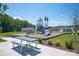 Community playground features modern play structure, slides, picnic table, and well-maintained green space at 3263 Maple Ridge Dr, Gastonia, NC 28052