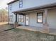Exterior view of a covered porch with stone columns on a blue two-story home at 3528 Thunder Rd, Maiden, NC 28650
