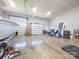 Spacious garage with two doors and a boat on a trailer for storing vehicles and equipment at 3528 Thunder Rd, Maiden, NC 28650
