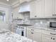Bright kitchen features granite countertops, stainless steel appliances, and ample cabinet space at 3528 Thunder Rd, Maiden, NC 28650