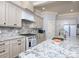 Beautiful kitchen with stainless appliances, white cabinets, and a granite countertop island at 3528 Thunder Rd, Maiden, NC 28650