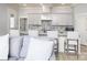 The kitchen includes white cabinets, an island, bar stool seating, and stainless appliances at 3528 Thunder Rd, Maiden, NC 28650