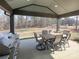 Enjoy outdoor dining with this covered patio featuring a built-in grill and spacious seating area at 3528 Thunder Rd, Maiden, NC 28650