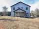 Expansive backyard with a charming home featuring a covered patio perfect for outdoor gatherings and relaxation at 3528 Thunder Rd, Maiden, NC 28650