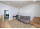 Relaxing sitting room features a comfortable futon, soft rug, and plenty of natural light from the adjacent office at 3528 Thunder Rd, Maiden, NC 28650