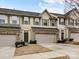 Charming townhouse with a two-car garage, neat landscaping, and light-colored exterior paint at 3541 Hornets Nest Way, Charlotte, NC 28208