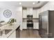 Charming kitchen with stainless steel appliances, granite countertops, and white cabinets with subway tile backsplash at 3541 Hornets Nest Way, Charlotte, NC 28208