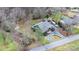 An aerial view showcases the home's roof, driveway, and surrounding landscaped yard at 406 Third Ne Ave, Conover, NC 28613