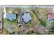 Drone's eye view of property lines, showcasing the home, lush landscape, and proximity to the water at 406 Third Ne Ave, Conover, NC 28613