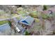 An aerial view showcases the home's unique roof, driveway, and surrounding trees at 406 Third Ne Ave, Conover, NC 28613