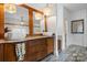 Bathroom with dual sinks, wood cabinet, granite countertop, and stylish lighting at 406 Third Ne Ave, Conover, NC 28613